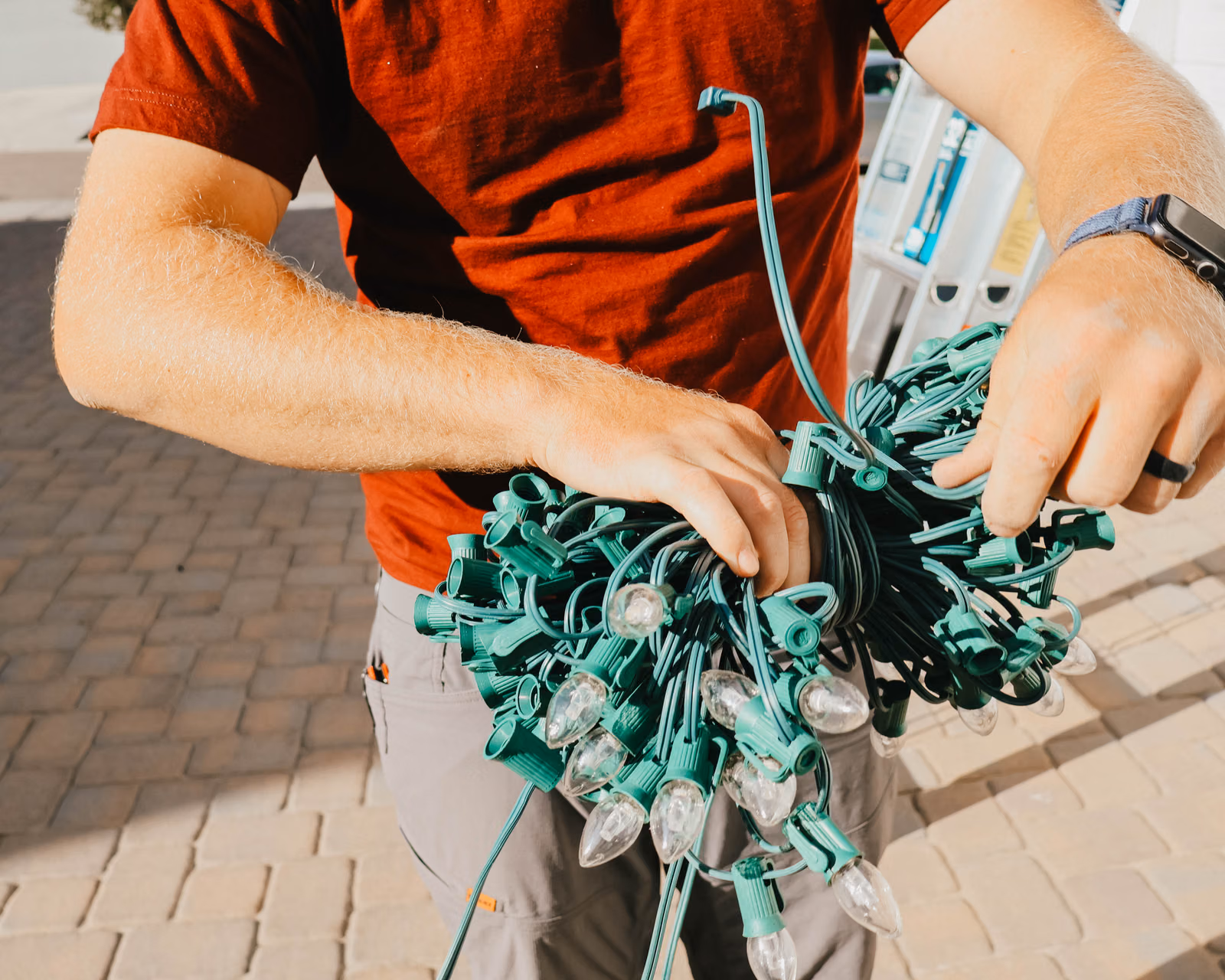 Bundle of commercial-grade Christmas lights prepared for installation