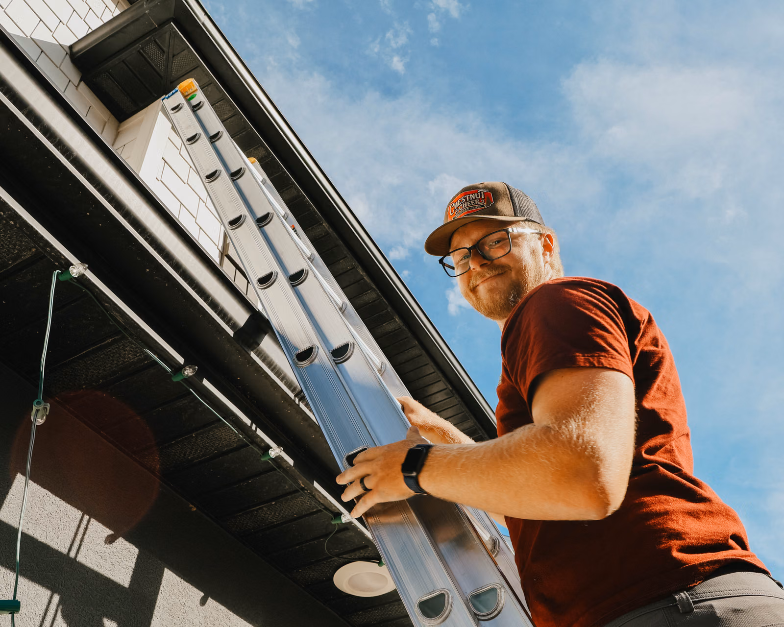 Chestnut & Cheer technician installing professional Christmas lights in Utah